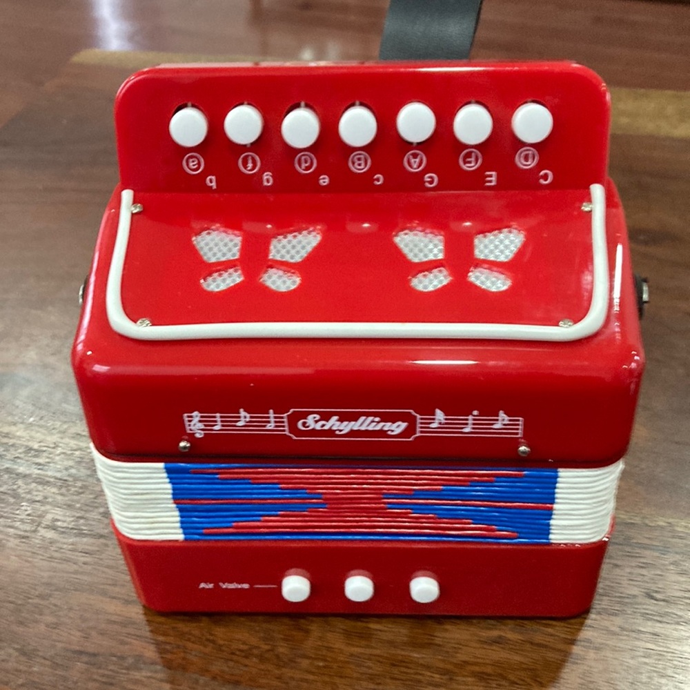 Schylling Kids Accordion. In perfect condition and works great.